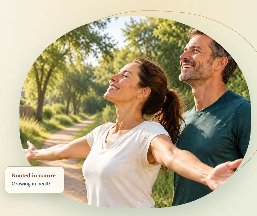 A joyful couple breathing deeply on a sunlit nature trail, with the message Rooted in nature, growing in health